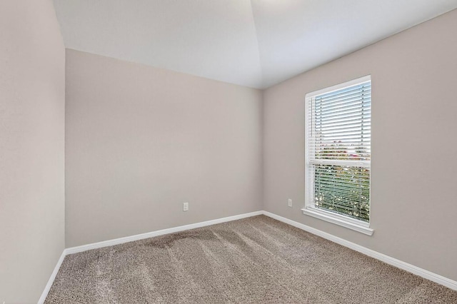 12301 Amber Lynn Path, Manor, TX 78653 - carpeted empty room with baseboards and vaulted ceiling