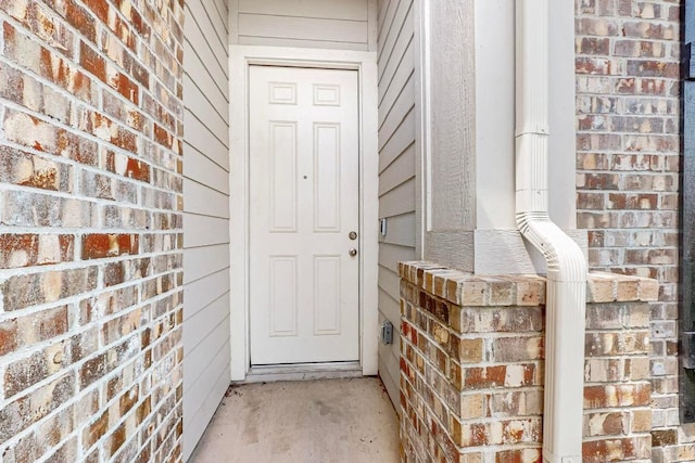 12301 Amber Lynn Path, Manor, TX 78653 - doorway to property with brick siding