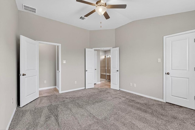 12301 Amber Lynn Path, Manor, TX 78653 - unfurnished bedroom featuring lofted ceiling, light carpet, ensuite bath, and ceiling fan