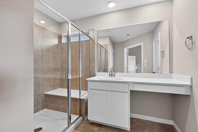 12301 Amber Lynn Path, Manor, TX 78653 - bathroom featuring vanity, a shower stall, and tile patterned flooring