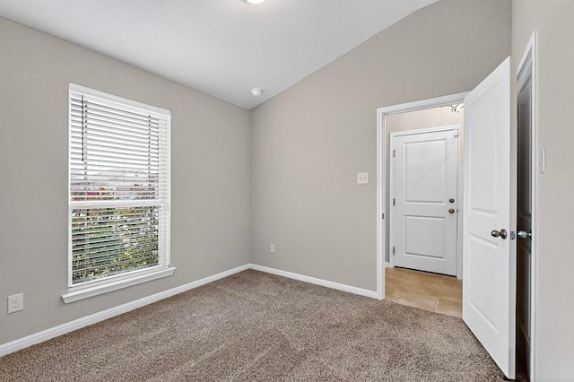 12301 Amber Lynn Path, Manor, TX 78653 - spare room featuring healthy amount of natural light, light colored carpet, and vaulted ceiling
