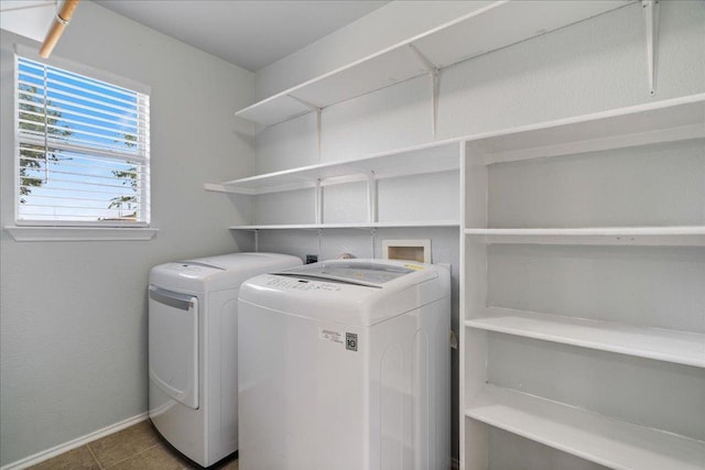 2102 Garrison Dr, Leander, TX 78641 - washroom with independent washer and dryer and tile patterned floors