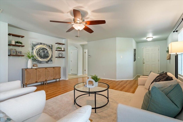 2102 Garrison Dr, Leander, TX 78641 - living area featuring wood finished floors and ceiling fan