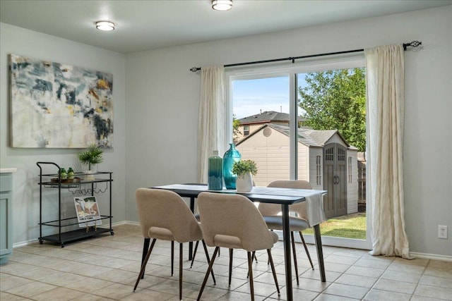 2102 Garrison Dr, Leander, TX 78641 - dining area with light tile patterned floors and baseboards