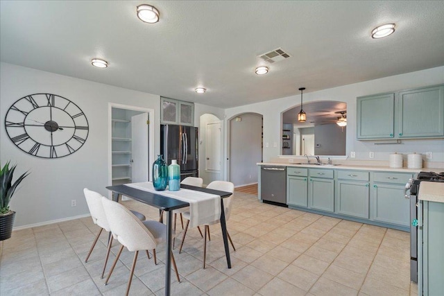 2102 Garrison Dr, Leander, TX 78641 - dining room featuring arched walkways, light tile patterned floors, and ceiling fan