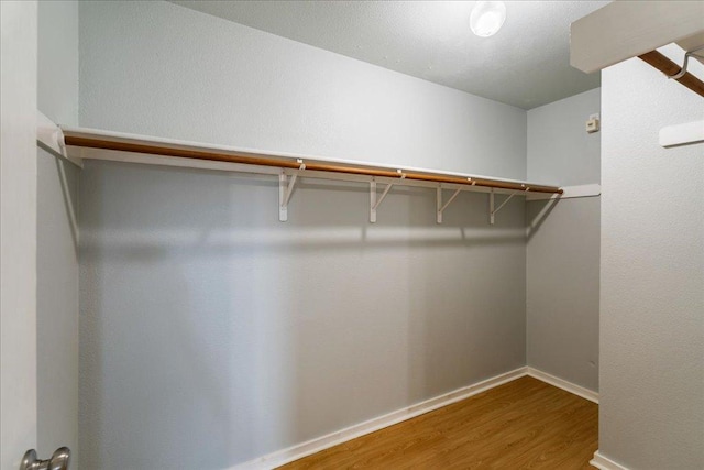 2102 Garrison Dr, Leander, TX 78641 - spacious closet with wood finished floors