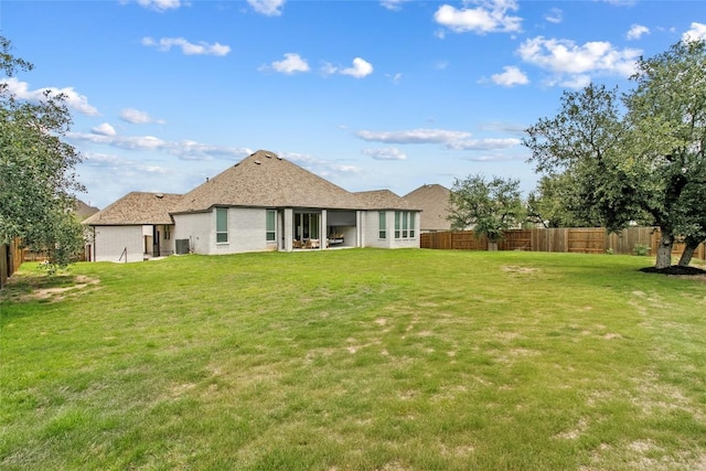 237 Honey Bee Ln, Austin, TX 78737 - rear view of house with a fenced backyard