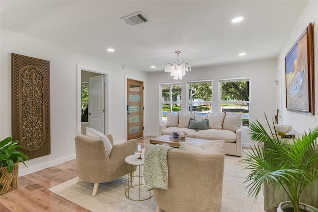7806 Mullen Dr, Austin, TX 78757 - living room featuring a chandelier, recessed lighting, and light wood-type flooring