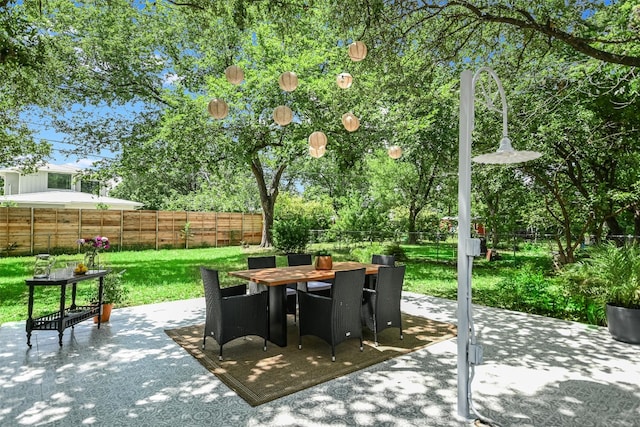 7806 Mullen Dr, Austin, TX 78757 - fenced backyard with outdoor dining space and a patio area