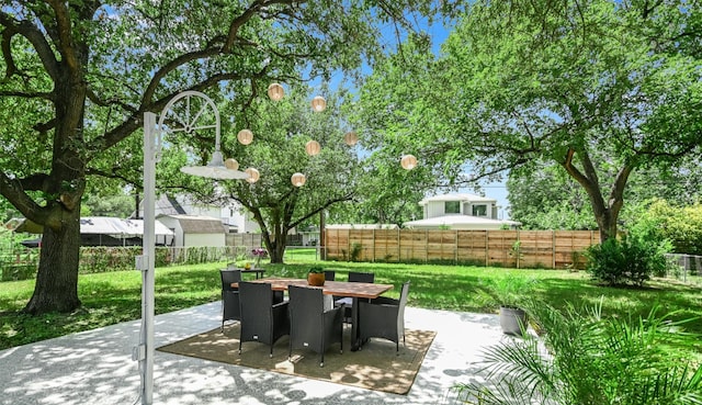 7806 Mullen Dr, Austin, TX 78757 - fenced backyard featuring a patio area and outdoor dining space