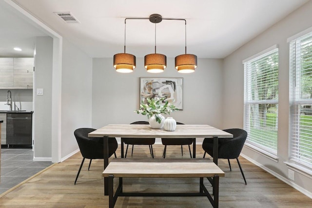 13101 Silver Creek Dr, Austin, TX 78727 - dining room featuring baseboards and wood finished floors