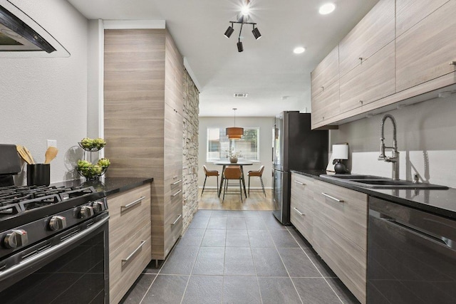 13101 Silver Creek Dr, Austin, TX 78727 - kitchen featuring stainless steel appliances, modern cabinets, dark countertops, ventilation hood, and dark tile patterned floors