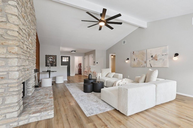 13101 Silver Creek Dr, Austin, TX 78727 - living room with a ceiling fan, wood finished floors, and a large fireplace