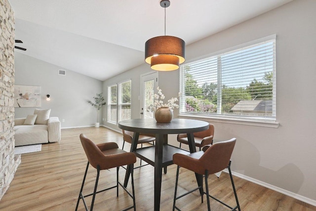 13101 Silver Creek Dr, Austin, TX 78727 - dining space with wood finished floors and lofted ceiling