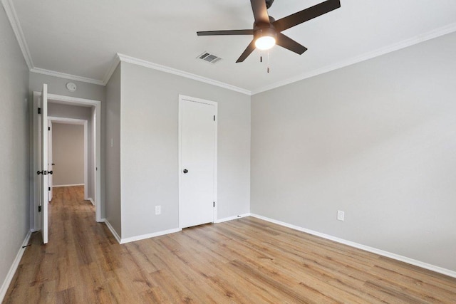 13101 Silver Creek Dr, Austin, TX 78727 - unfurnished bedroom with light wood-style flooring, ornamental molding, a ceiling fan, and a closet