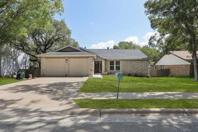 13101 Silver Creek Dr, Austin, TX 78727 - single story home featuring an attached garage, driveway, stone siding, and roof with shingles
