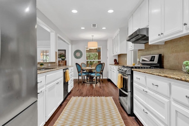 4001 Greystone Dr, Austin, TX 78731 - kitchen featuring stainless steel appliances, ventilation hood, tasteful backsplash, white cabinets, and recessed lighting