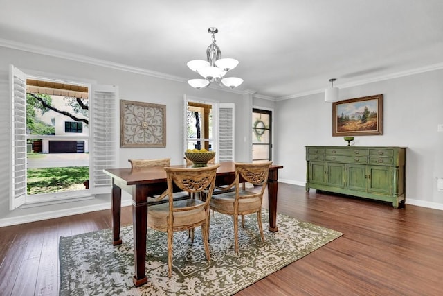 4001 Greystone Dr, Austin, TX 78731 - dining space featuring a chandelier, plenty of natural light, dark wood-style floors, and crown molding