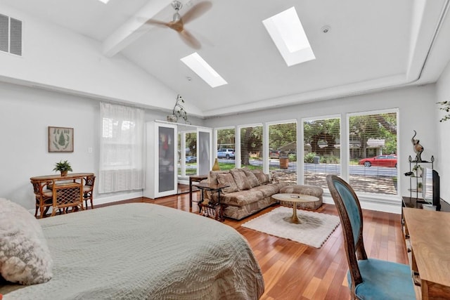 4001 Greystone Dr, Austin, TX 78731 - bedroom featuring a skylight, beam ceiling, multiple windows, wood finished floors, and high vaulted ceiling