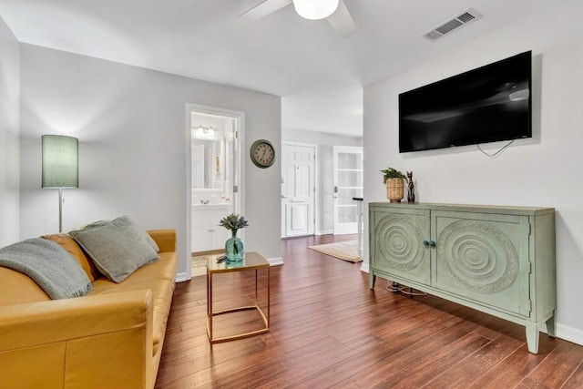 4001 Greystone Dr, Austin, TX 78731 - living area with dark wood-style flooring and a ceiling fan