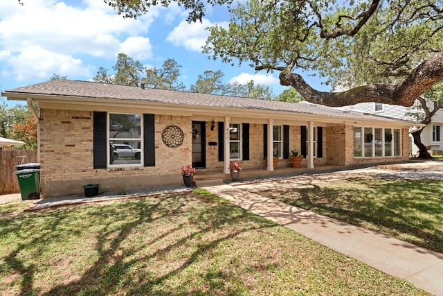 4001 Greystone Dr, Austin, TX 78731 - ranch-style house with brick siding and a porch