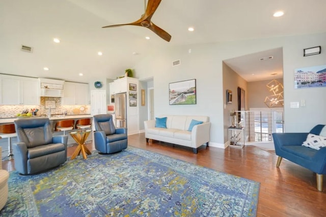 136 Web Isle Dr, Granite Shoals, TX 78654 - living area with wood finished floors, ceiling fan, high vaulted ceiling, and recessed lighting