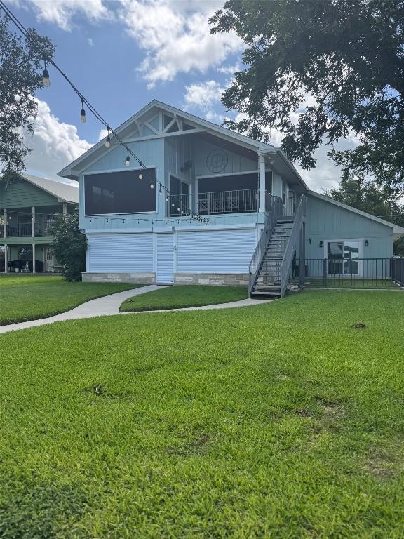 136 Web Isle Dr, Granite Shoals, TX 78654 - view of front of home featuring stairs, a front lawn, and crawl space