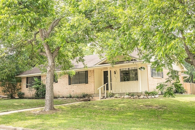 215 Edward Ln, Brenham, TX 77833 - view of front of home with brick siding and a shingled roof