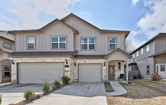 3303 Elija St Unit A & B, Austin, TX 78745 - townhome / multi-family property with stone siding, a garage, concrete driveway, and board and batten siding