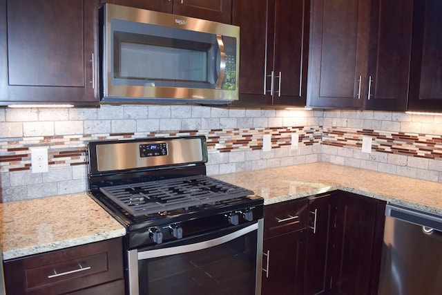 3303 Elija St Unit A & B, Austin, TX 78745 - kitchen with appliances with stainless steel finishes and dark brown cabinetry
