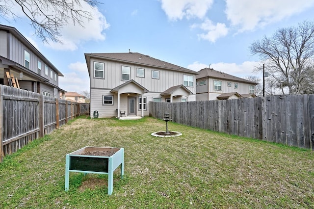 3303 Elija St Unit A & B, Austin, TX 78745 - rear view of property featuring board and batten siding and a fenced backyard