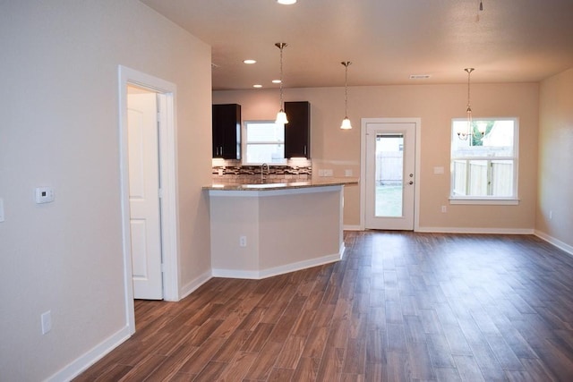3303 Elija St Unit A & B, Austin, TX 78745 - kitchen with a chandelier, dark wood-style flooring, decorative backsplash, healthy amount of natural light, and recessed lighting