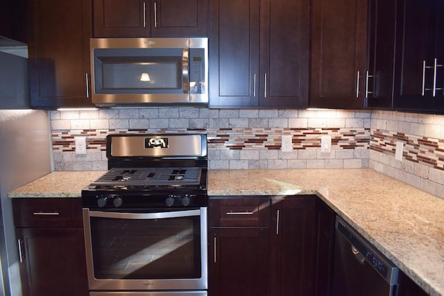 3303 Elija St Unit A & B, Austin, TX 78745 - kitchen featuring appliances with stainless steel finishes, tasteful backsplash, and dark brown cabinetry