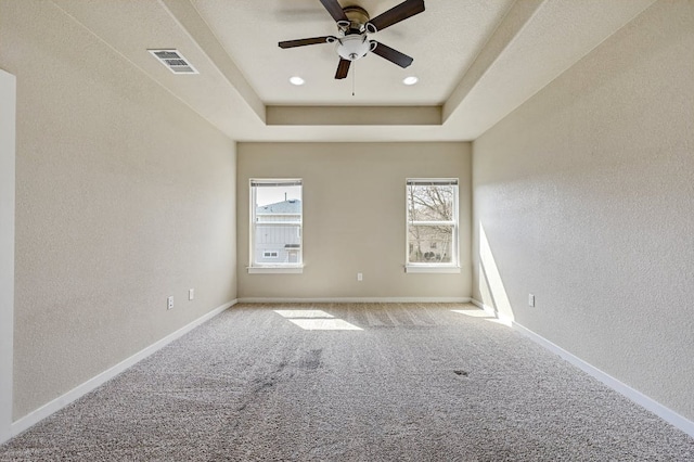 3303 Elija St Unit A & B, Austin, TX 78745 - unfurnished room with ceiling fan, a textured wall, carpet floors, and a tray ceiling