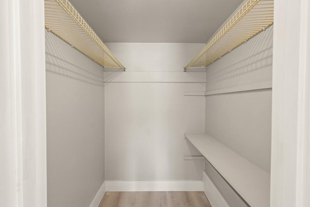 2600 Penny Ln Unit 115, Austin, TX 78757 - spacious closet with wood finished floors