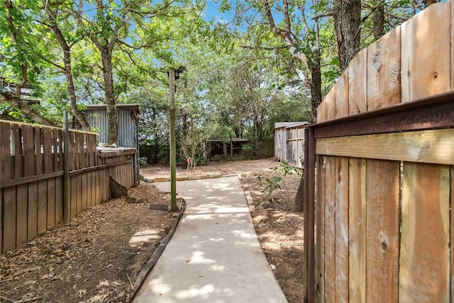 208 Old Potato Rd, Paige, TX 78659 - fenced backyard featuring a patio
