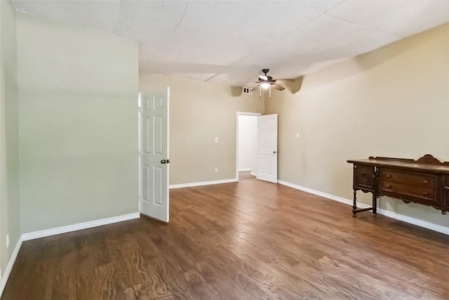 208 Old Potato Rd, Paige, TX 78659 - spare room with ceiling fan and wood finished floors