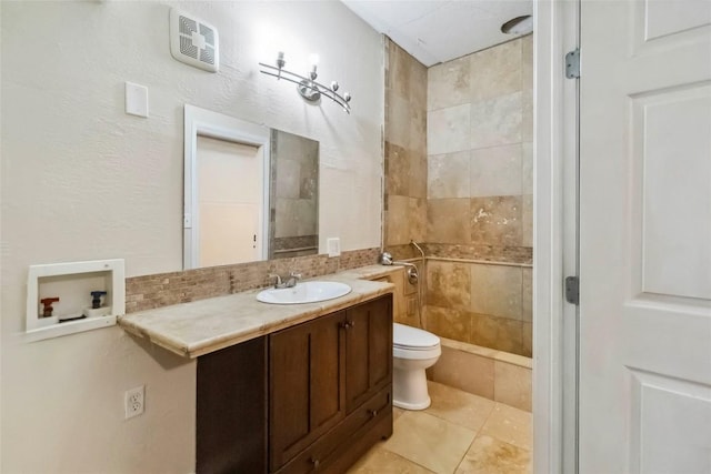 208 Old Potato Rd, Paige, TX 78659 - bathroom with tiled shower, vanity, tile patterned flooring, and decorative backsplash
