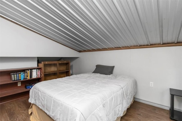 208 Old Potato Rd, Paige, TX 78659 - bedroom with lofted ceiling and wood finished floors