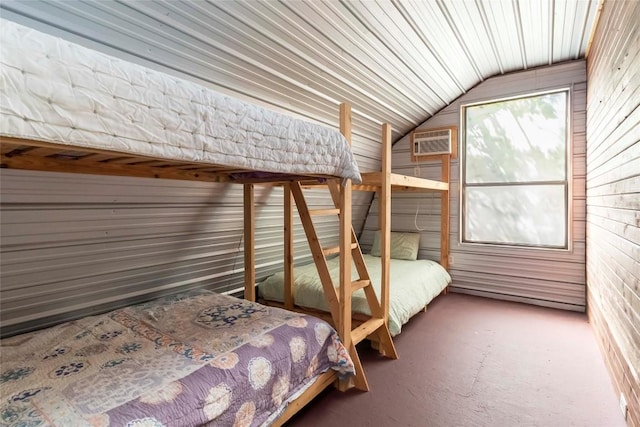 208 Old Potato Rd, Paige, TX 78659 - carpeted bedroom featuring lofted ceiling, a wall mounted air conditioner, and wood walls