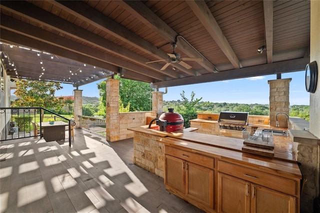 3810 Pawnee Pass, Austin, TX 78738 - view of patio featuring an outdoor kitchen and a ceiling fan