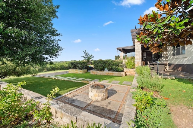 3810 Pawnee Pass, Austin, TX 78738 - view of grassy yard featuring a fire pit and a patio area