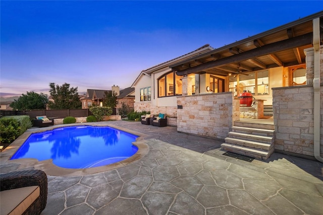 3810 Pawnee Pass, Austin, TX 78738 - pool at dusk with a patio area, ceiling fan, and a fenced backyard