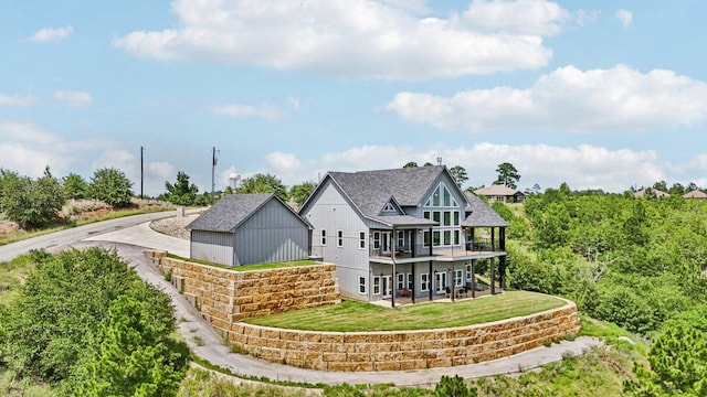 169 Tall Forest Dr, Bastrop, TX 78602 - rear view of house with a yard, roof with shingles, and a deck
