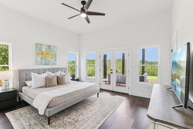 169 Tall Forest Dr, Bastrop, TX 78602 - bedroom featuring access to exterior, french doors, dark wood finished floors, a towering ceiling, and ceiling fan