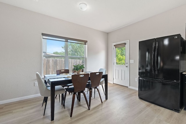 3526 Wickham Ln, Austin, TX 78725 - dining area with light wood-type flooring and baseboards