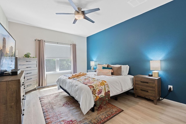 3526 Wickham Ln, Austin, TX 78725 - bedroom featuring light wood finished floors and a ceiling fan