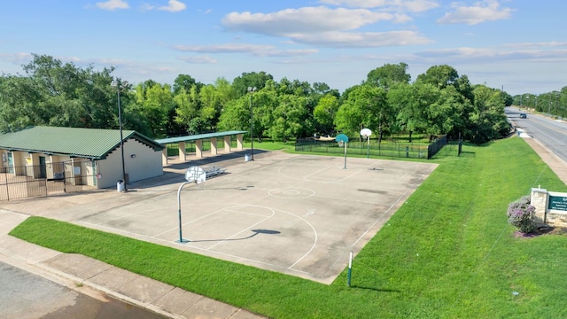 3526 Wickham Ln, Austin, TX 78725 - surrounding community with community basketball court and view of wooded area