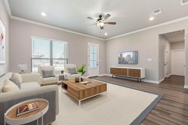 103 W Tomlinson St, Florence, TX 76527 - living room with ceiling fan, wood finished floors, recessed lighting, and ornamental molding