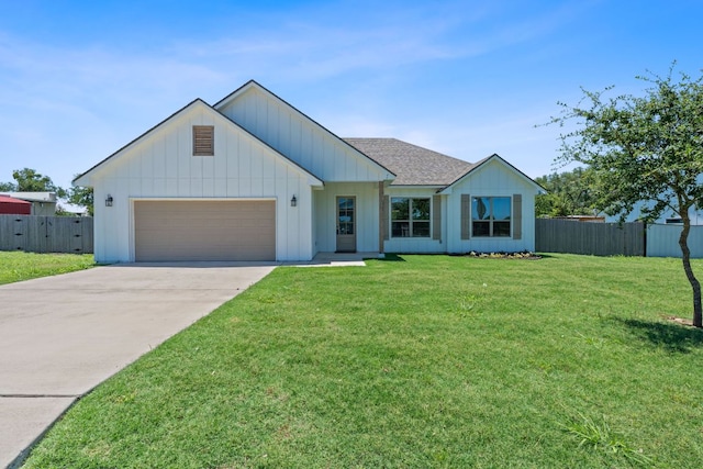 103 W Tomlinson St, Florence, TX 76527 - modern farmhouse style home featuring an attached garage, concrete driveway, and board and batten siding